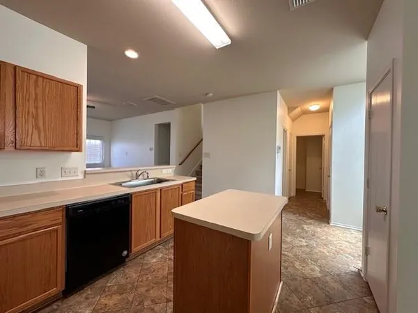 a kitchen with a sink and cabinets