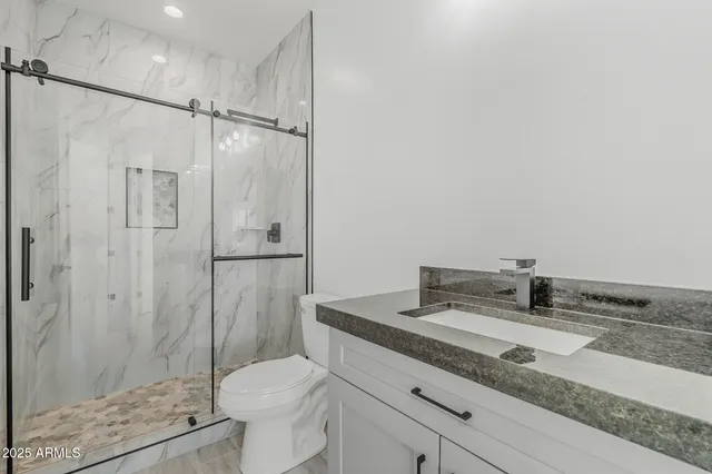 a view of a house with backyard and a garage