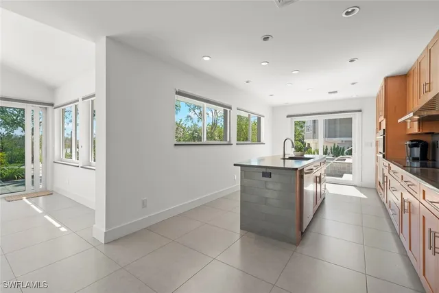 a view of a kitchen with furniture and an open kitchen view