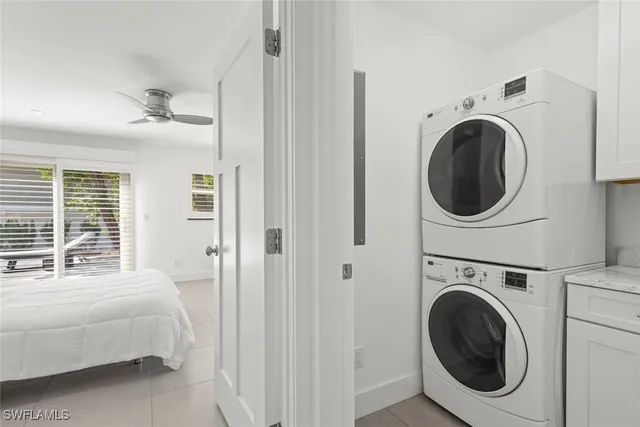 a bedroom with a washer and dryer
