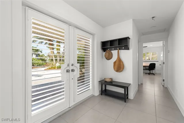 a living room with furniture a rug and a window