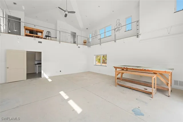 a view of room with stairs and furniture