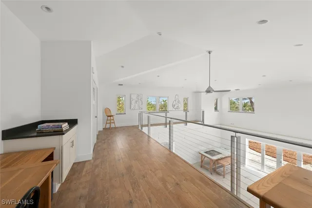 a view of a living room hardwood and a kitchen