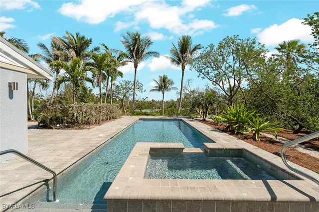 a view of swimming pool with a patio