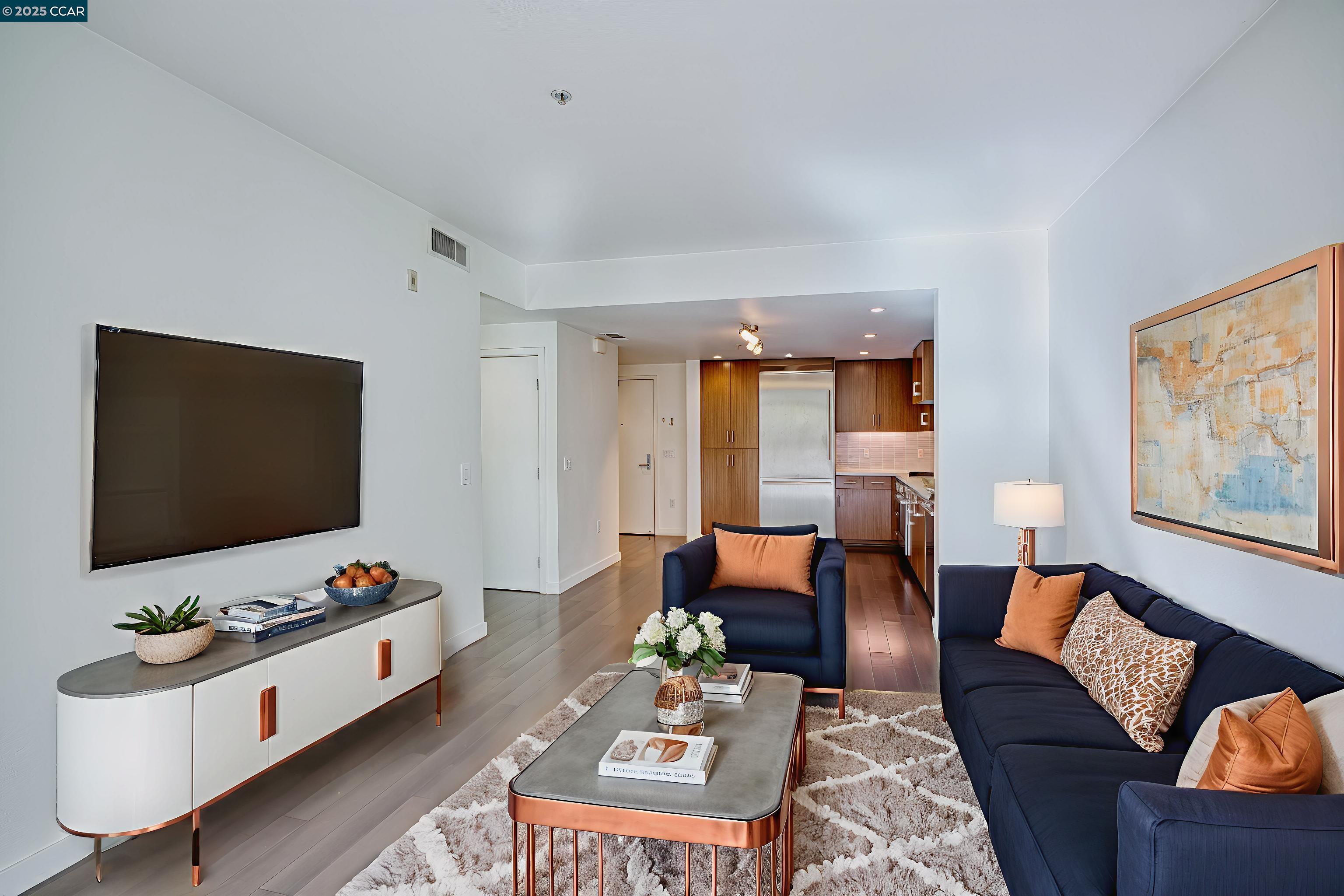 2655 Bush Street, Unit 110 San Francisco, CA 94115 - Photo 11 of 52 a living room with furniture and a flat screen tv