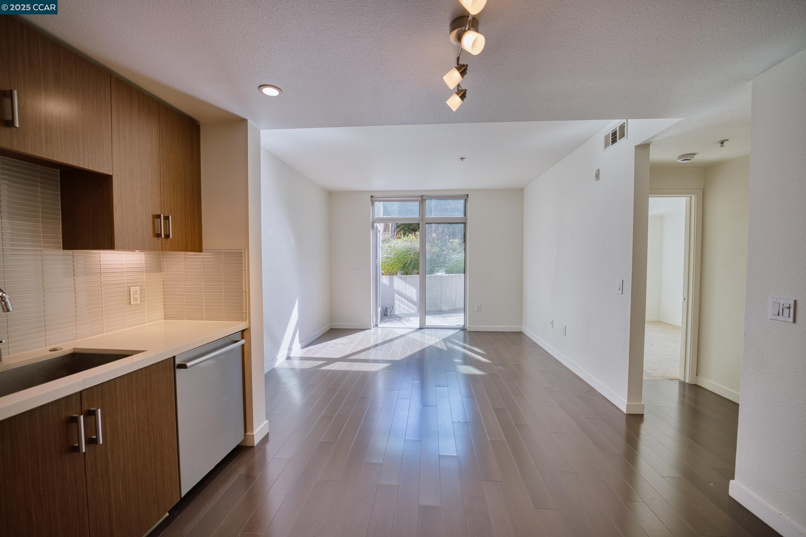 2655 Bush Street, Unit 110 San Francisco, CA 94115 - Photo 31 of 52 a view of a kitchen cabinets and wooden floor