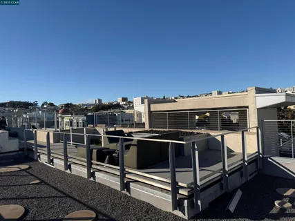a living room with furniture a flat screen tv and a large window