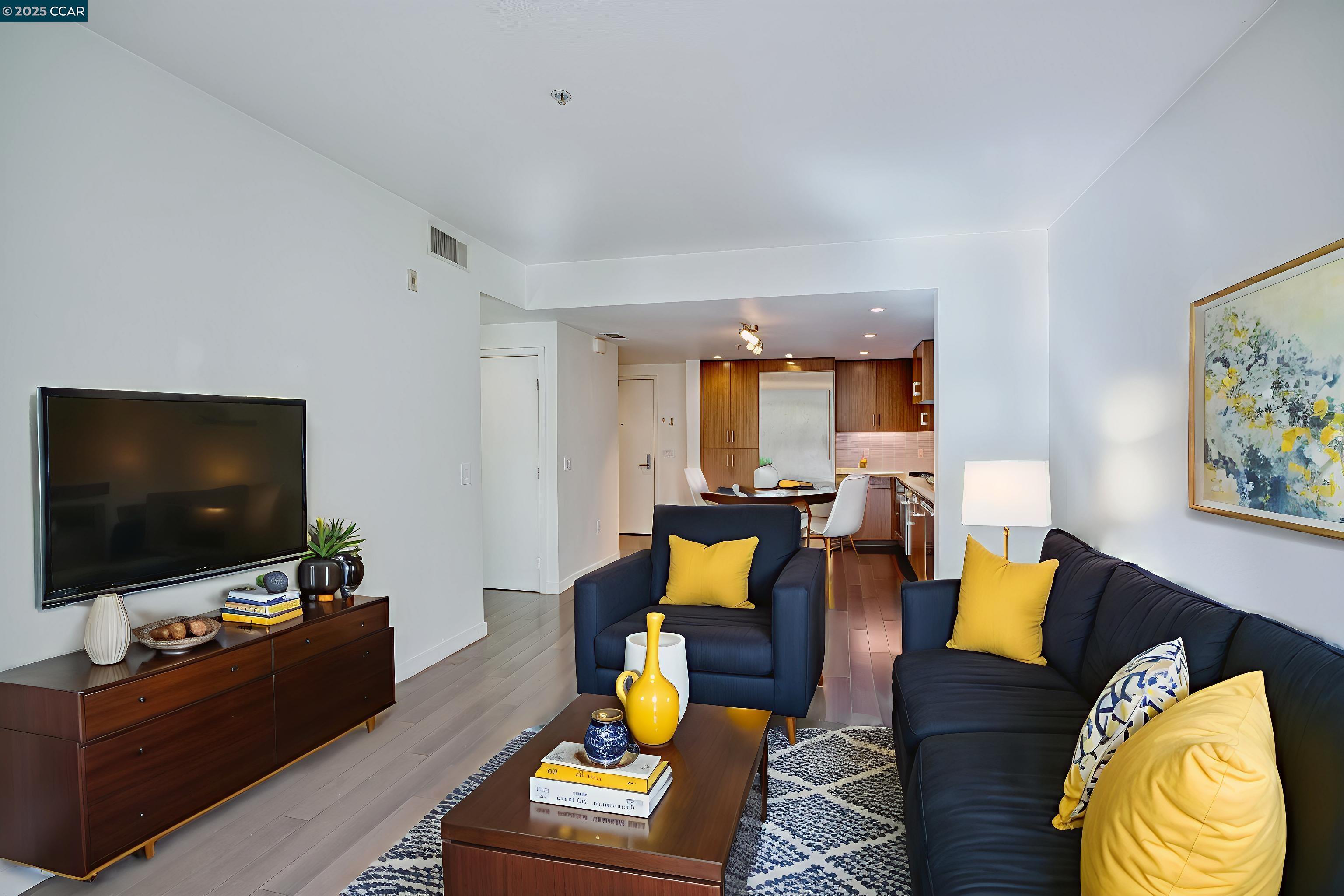 2655 Bush Street, Unit 110 San Francisco, CA 94115 - Photo 9 of 52 a living room with furniture and a flat screen tv
