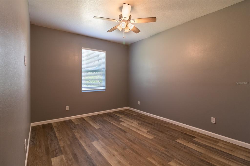 41550 Royal Trails Road Eustis, FL 32736 - Photo 18 of 25 a view of room with window and ceiling fan