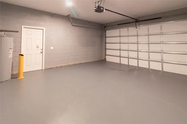 a view of a house with a yard and lake