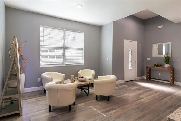 a living room with furniture and a window