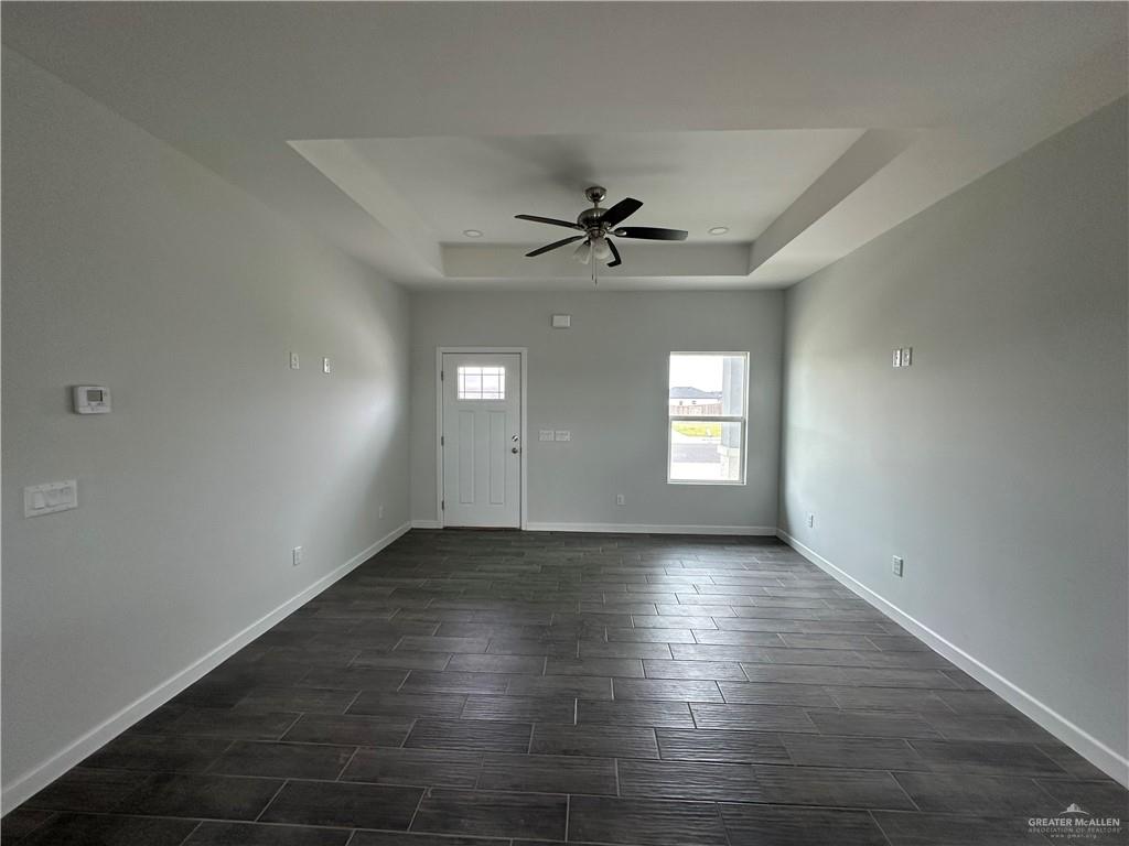 1708 Unity Drive Mercedes, TX 78570 - Photo 2 of 11 an empty room with window and wooden floor
