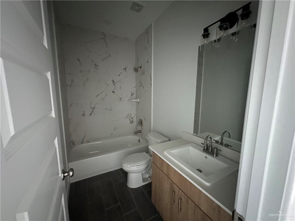 1708 Unity Drive Mercedes, TX 78570 - Photo 9 of 11 a bathroom with a sink toilet and shower