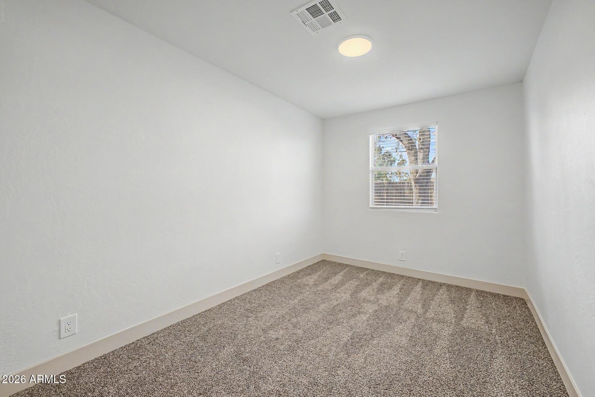1914 East Monte Vista Road Phoenix, AZ 85006 - Photo 19 of 26 an empty room with windows