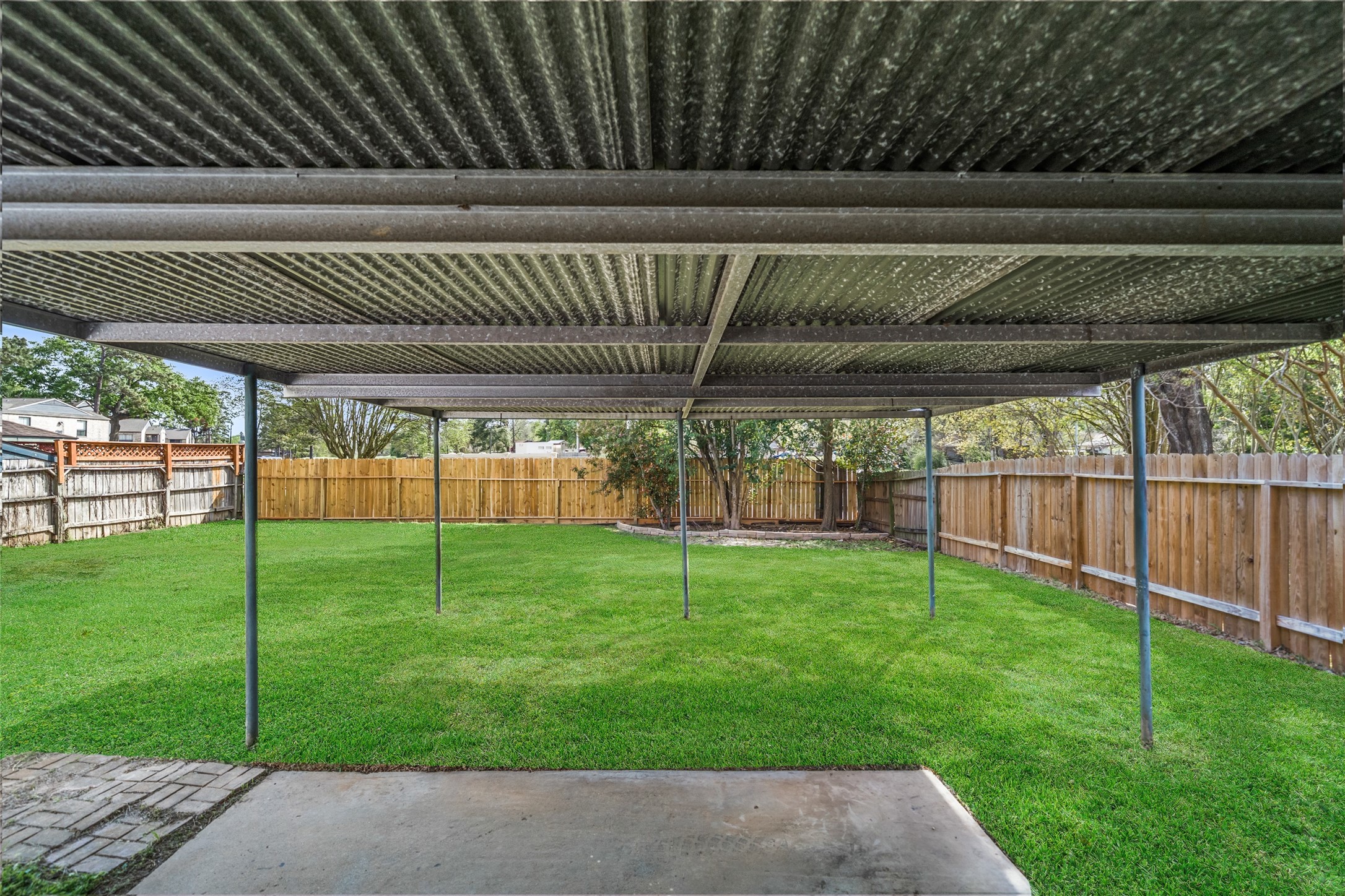 5726 Yorkgate Drive Spring, TX 77373 - Photo 19 of 20 a view of a backyard with plants and a patio