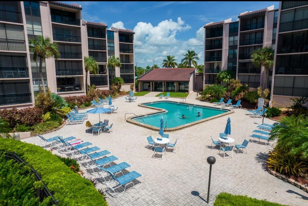 6480 Midnight Pass Road, Unit 316 Sarasota, FL 34242 - Photo 10 of 23 Community Pool with view of the Gulf of Mexico