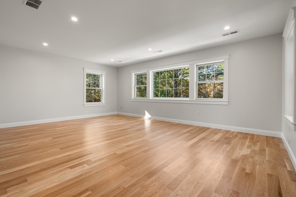 21 Quiet Street Sandwich, MA 02537 - Photo 11 of 15 an empty room with wooden floor and windows