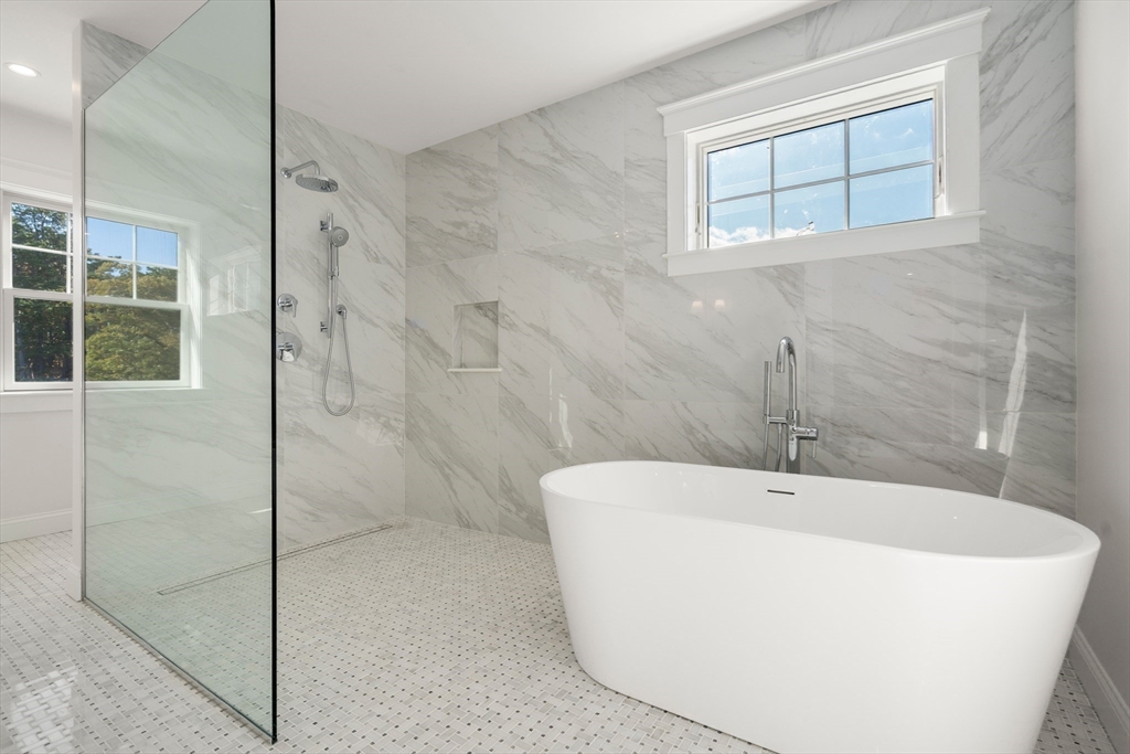 21 Quiet Street Sandwich, MA 02537 - Photo 12 of 15 a white bath tub sitting next to a shower