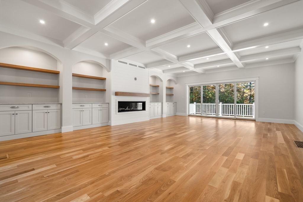 21 Quiet Street Sandwich, MA 02537 - Photo 5 of 15 a view of empty room with wooden floor and fireplace