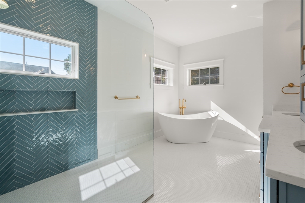 21 Quiet Street Sandwich, MA 02537 - Photo 10 of 15 a white tub sitting next to a white wall