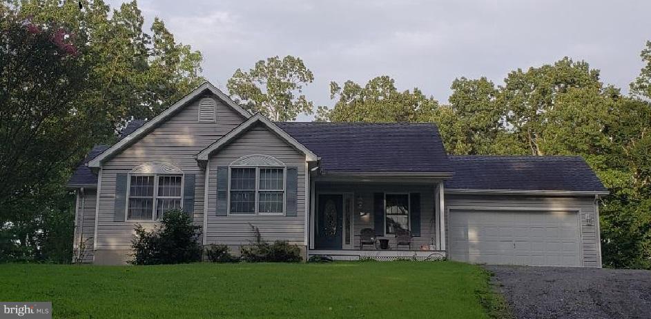 4010 St Leonard Road St. Leonard, MD 20685 - Photo 1 of 1 a view of a house with a yard and plants