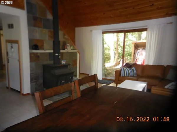 a living room with furniture window and wooden floor