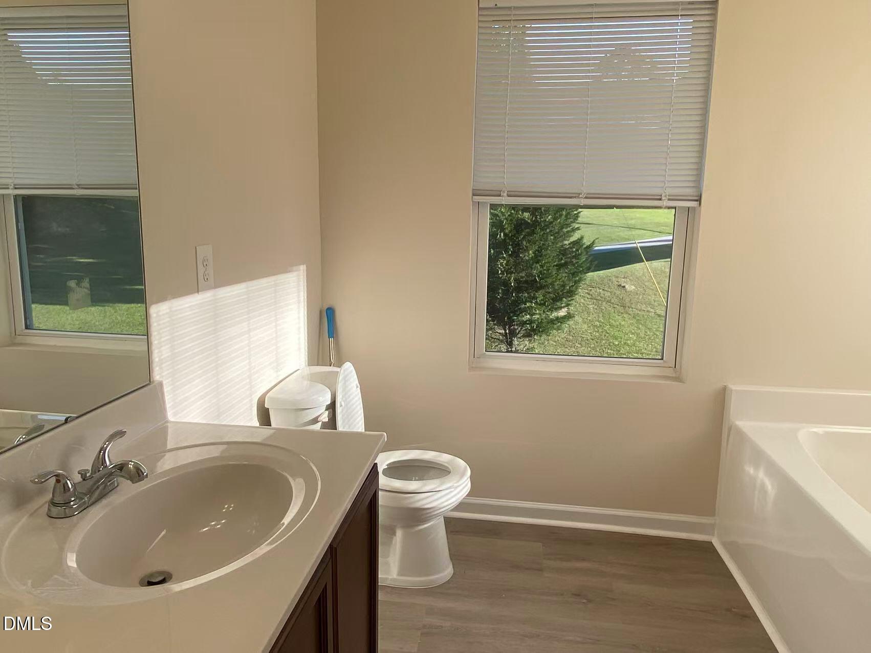 27 Ridgemoore Court Four Oaks, NC 27524 - Photo 12 of 24 a bathroom with a sink and a toilet