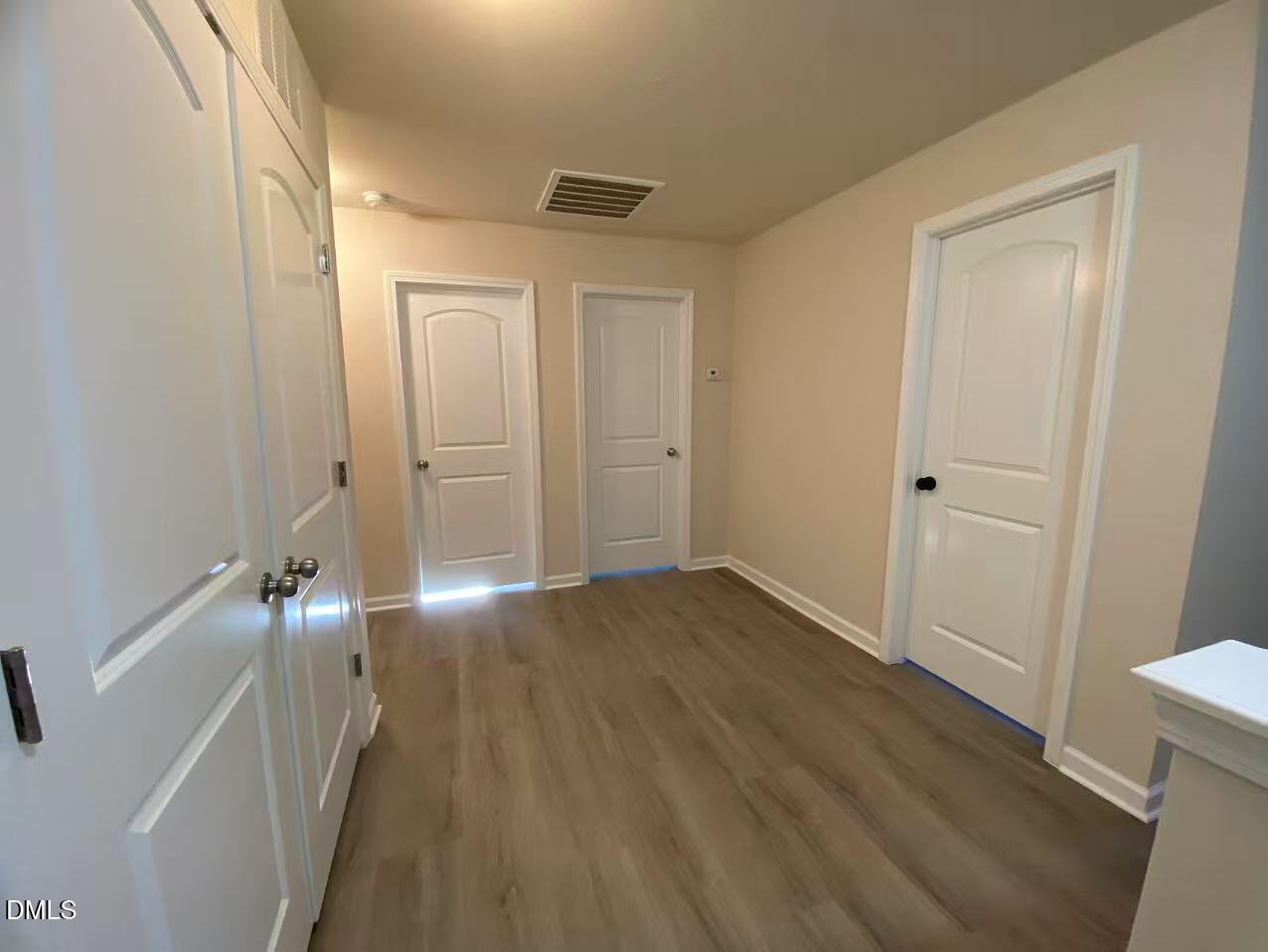 27 Ridgemoore Court Four Oaks, NC 27524 - Photo 17 of 24 a view of empty room with wooden floor