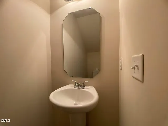 a view of a hallway to rooms