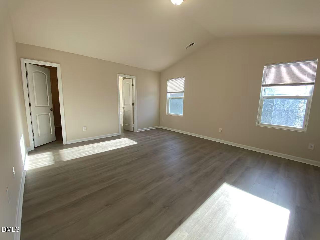 27 Ridgemoore Court Four Oaks, NC 27524 - Photo 8 of 24 a view of an empty room with wooden floor and a window