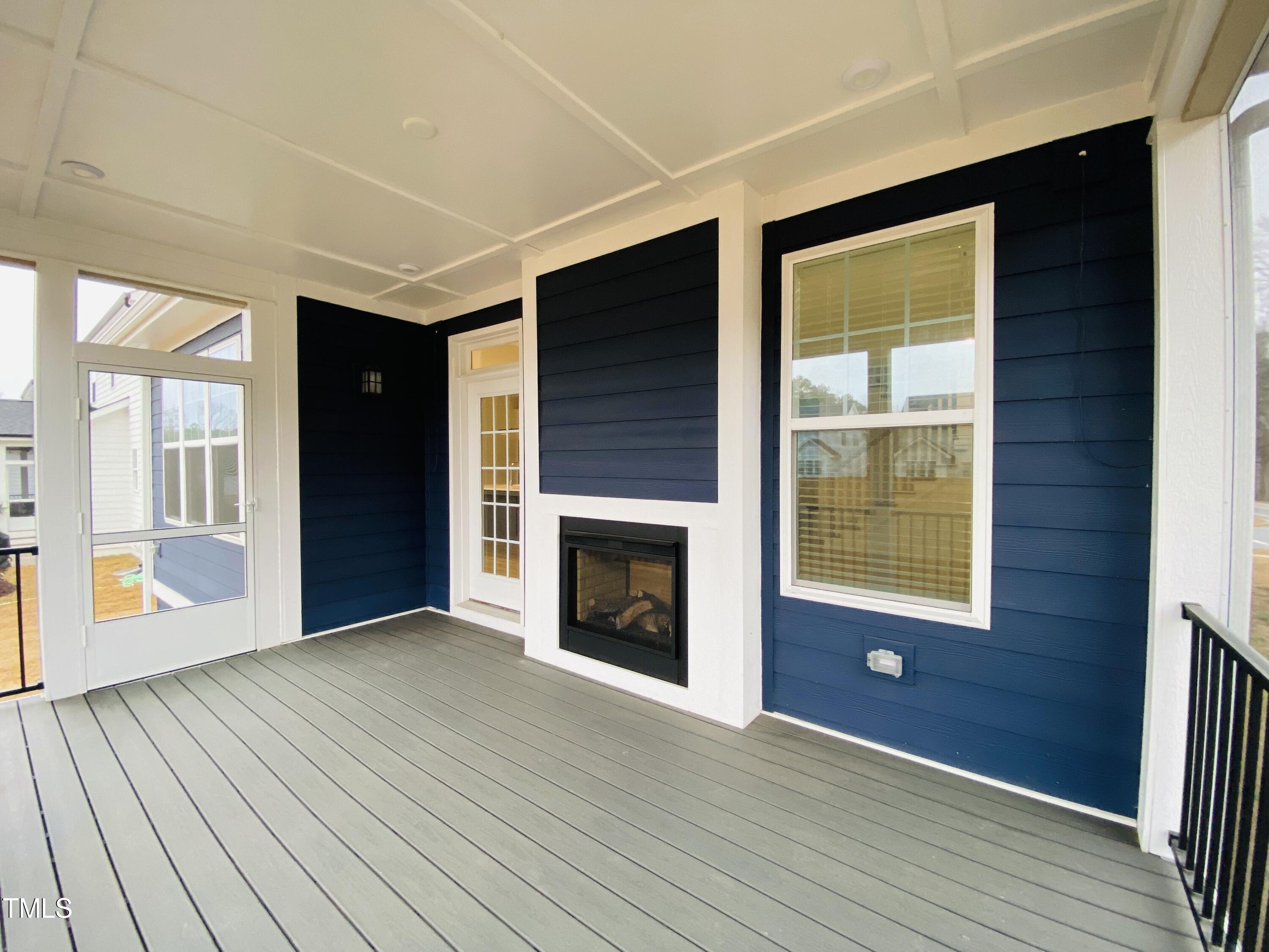 196 DUNLOE Loop Raleigh, NC 27603 - Photo 15 of 43 Screened in Porch with see through Fire Place