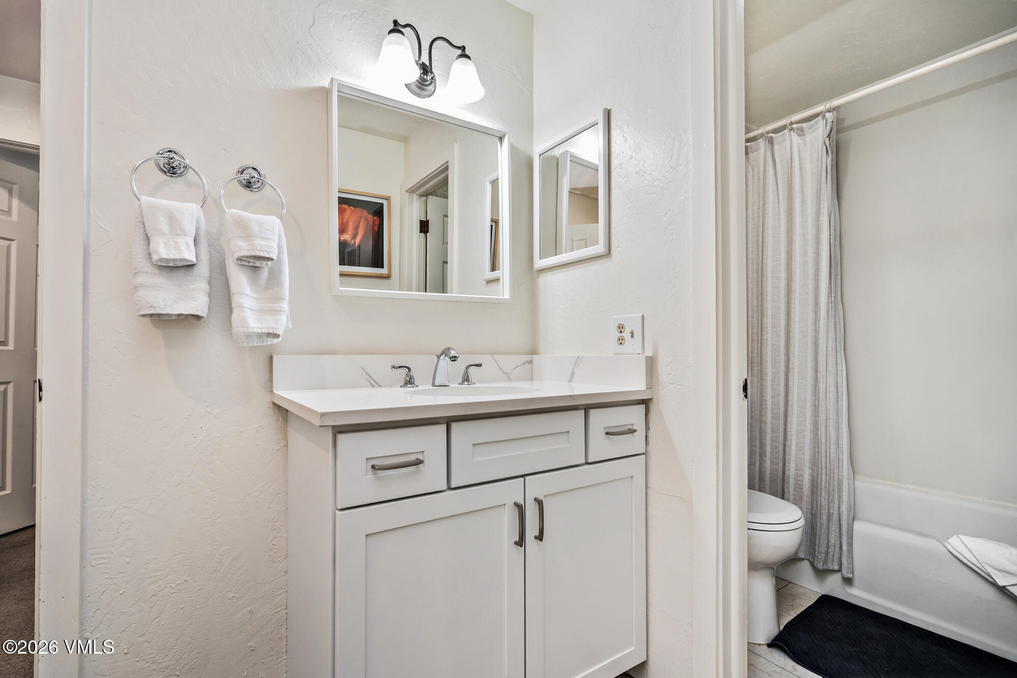 963 Lions Ridge Loop, Unit 502 Vail, CO 81657 - Photo 20 of 30 a bathroom with a sink a toilet and shower