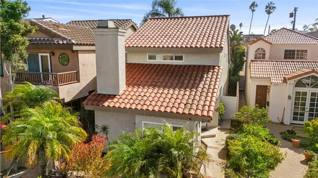 an aerial view of residential house with parking
