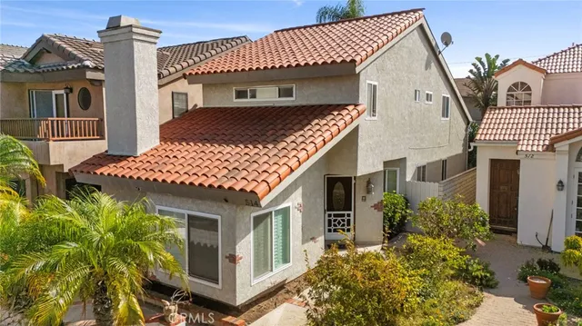an aerial view of a city with lots of residential buildings