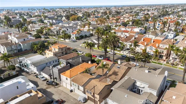 an aerial view of a house with a yard and balcony