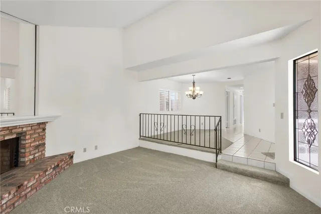 a view of livingroom with hardwood floor and a fireplace
