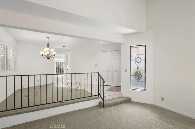 a view of a hallway with windows