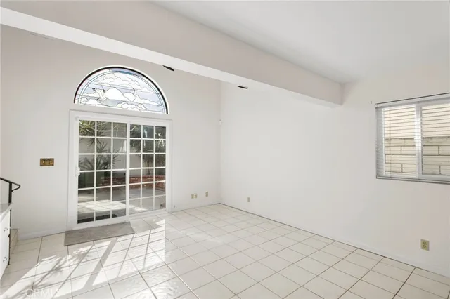 a view of a hallway with kitchen and entryway