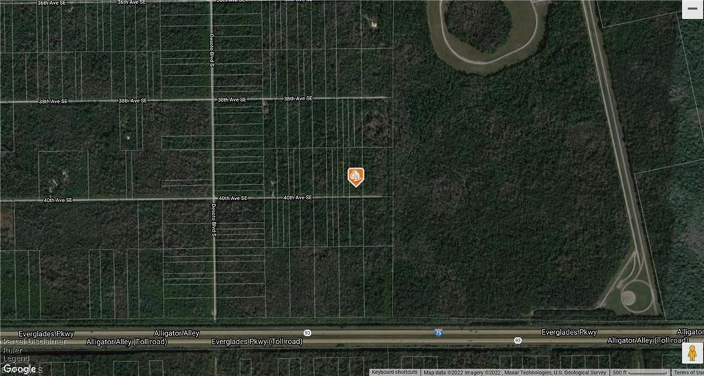 40th Avenue Southeast Naples, FL 34117 - Photo 2 of 2 a bathroom with a mirror and a shower