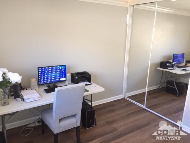 10394 Cochran Avenue Riverside, CA 92505 - Photo 12 of 12 a workspace with furniture and wooden floor