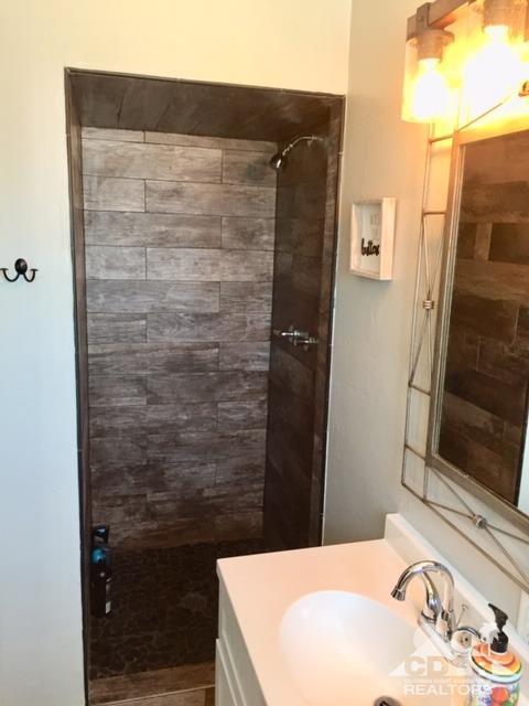 10394 Cochran Avenue Riverside, CA 92505 - Photo 3 of 12 a bathroom with a sink and a shower