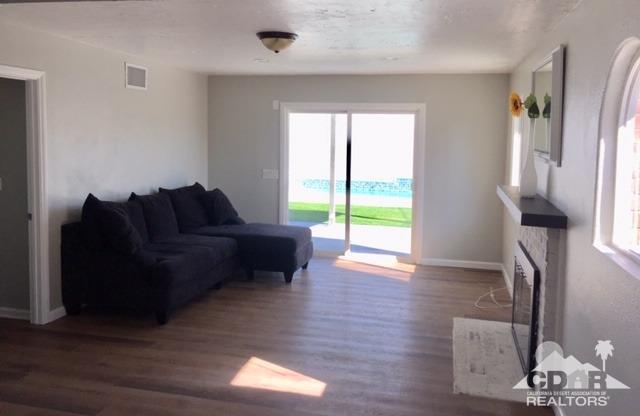 10394 Cochran Avenue Riverside, CA 92505 - Photo 10 of 12 a living room with furniture and a large window