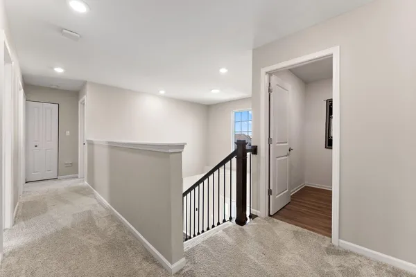 a view of a hallway view with staircase