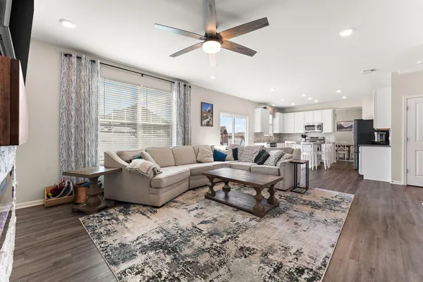 a living room with furniture and a large window