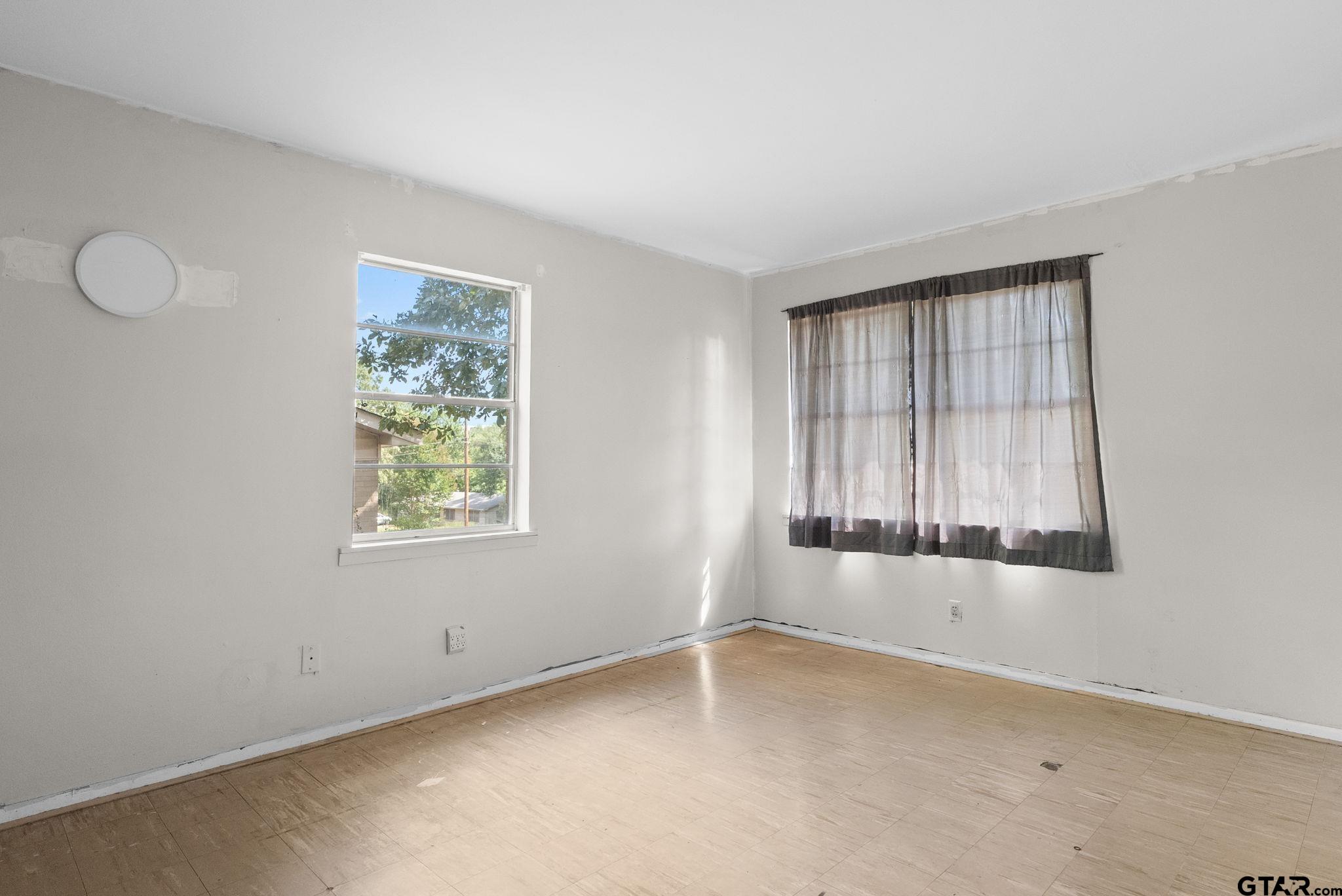 2002 Faulkner Street Tyler, TX 75701 - Photo 23 of 32 an empty room with windows