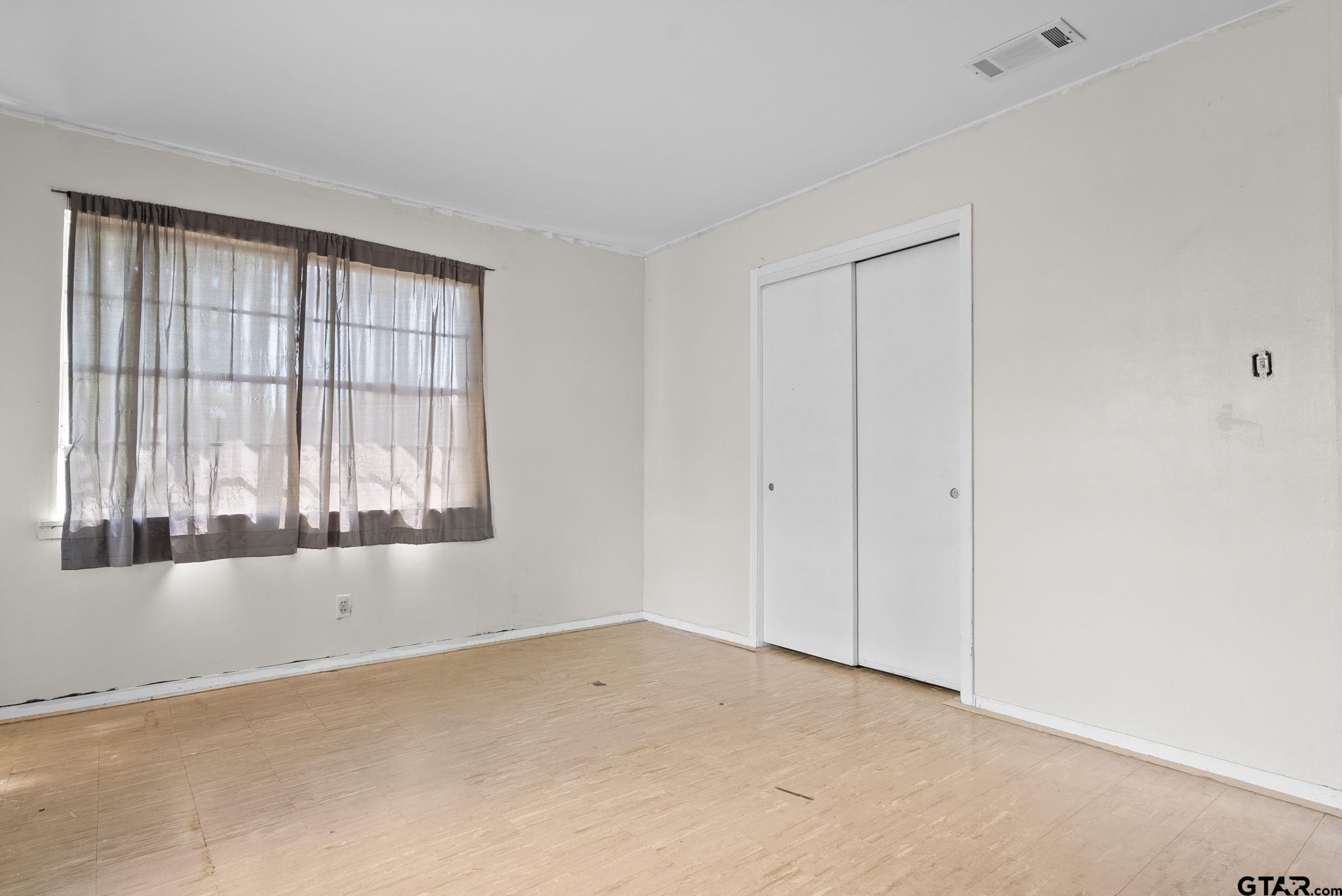 2002 Faulkner Street Tyler, TX 75701 - Photo 25 of 32 a view of an empty room with a window