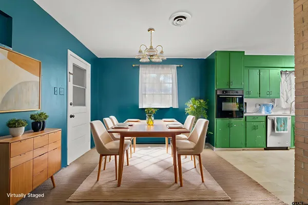 a dining room with a table and chairs