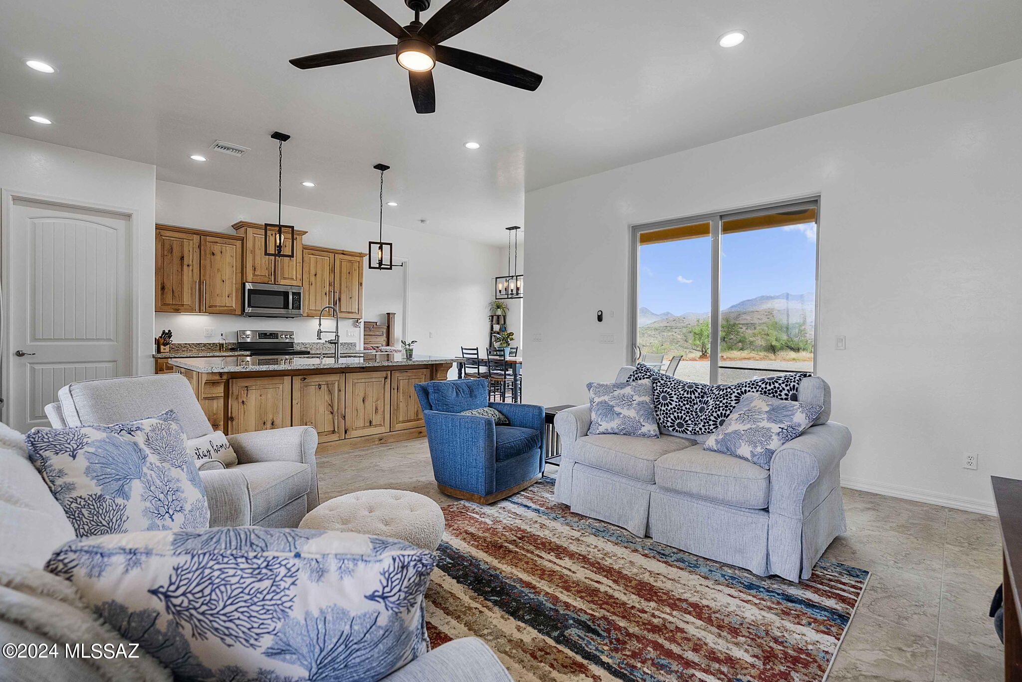 22 Vigas Lane Rio Rico, AZ 85648 - Photo 11 of 40 a living room with furniture and a large window