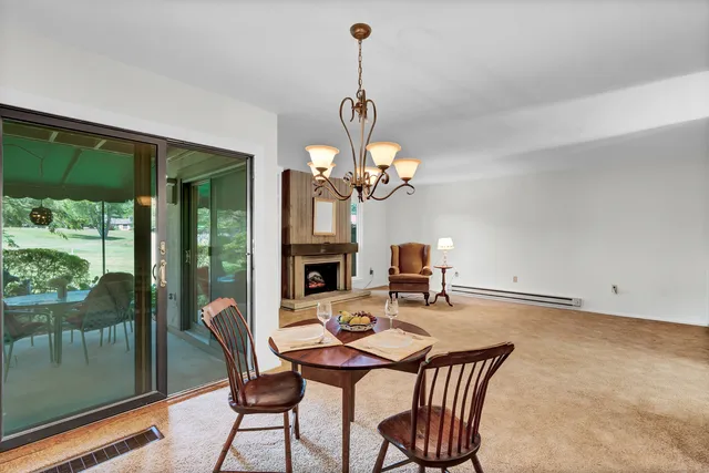 a kitchen with stainless steel appliances granite countertop a sink and a refrigerator
