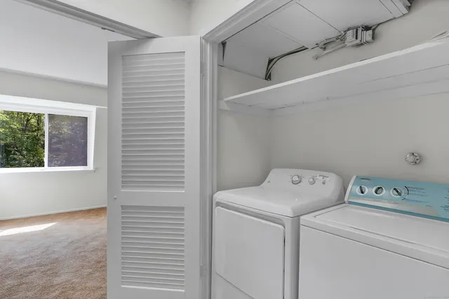 a front view of a house with a yard garage and outdoor seating